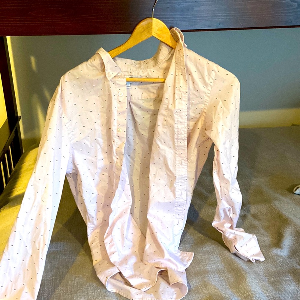 This is a pink button up shirt